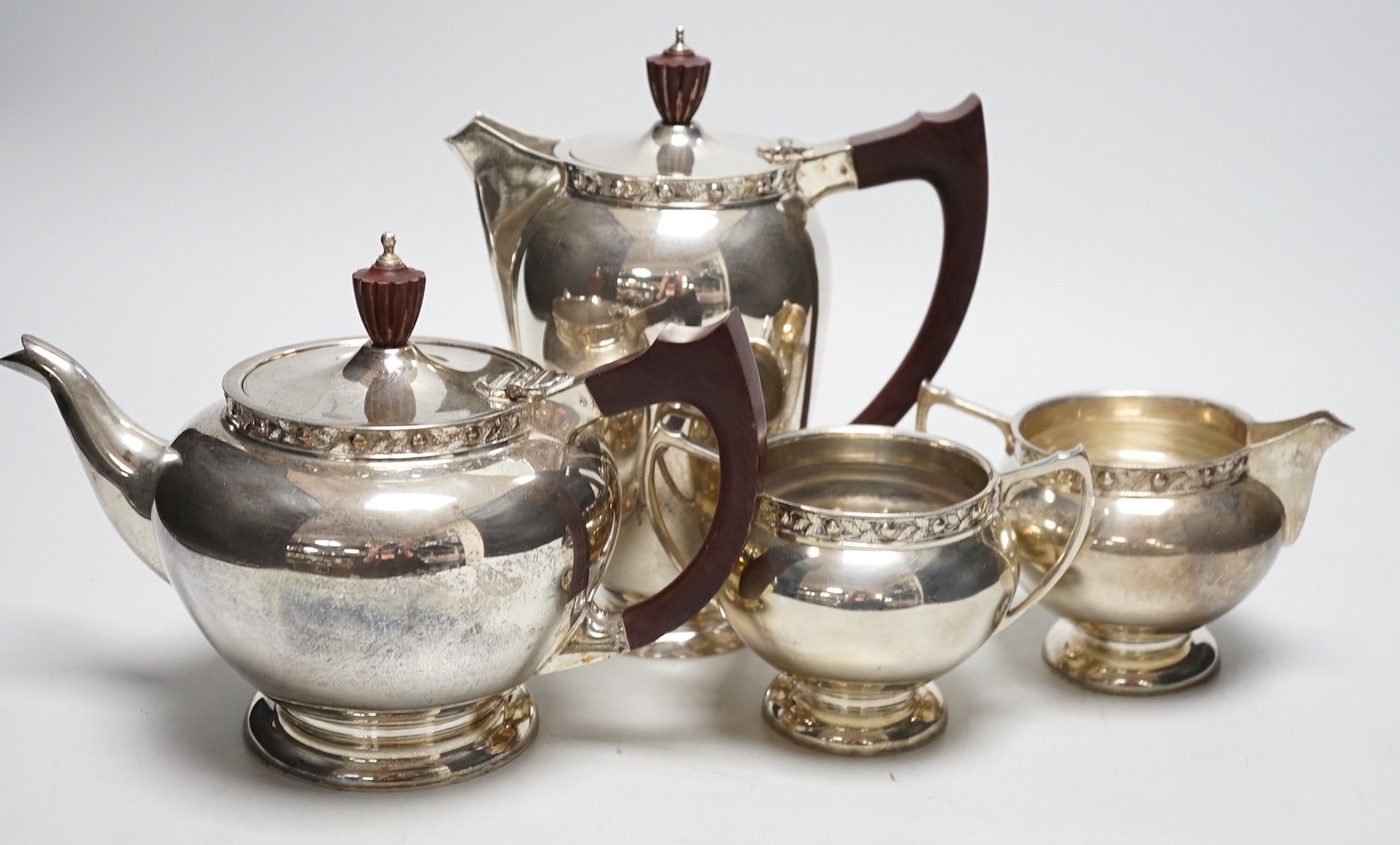 An Elizabeth II silver four piece tea set, with foliate border, A. E Jones Ltd, Birmingham, 1966, gross 65oz.